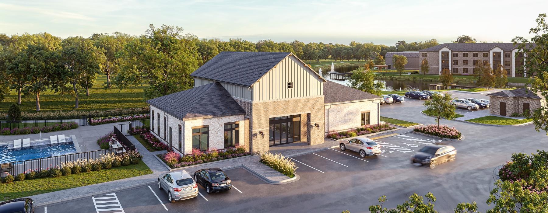 a building with a pool and cars parked in front of it