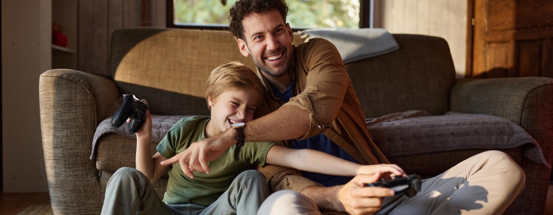 a person and a boy sitting on a couch